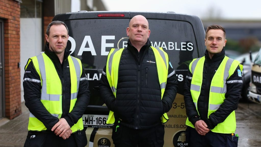 DAE Renewables Management Team, standing in from of Van with DAE Renewables Logo